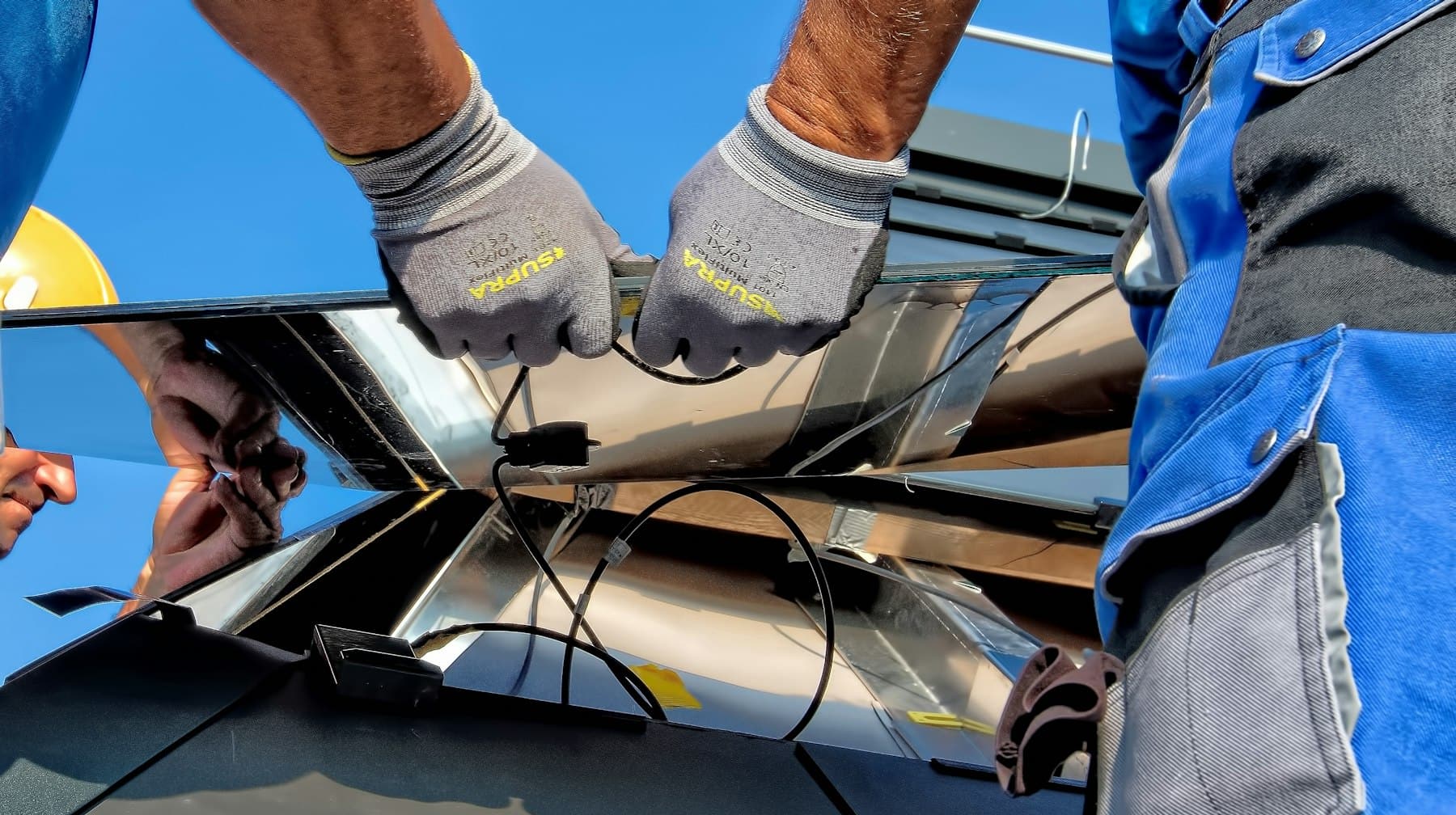 Technicians installing a solar module
